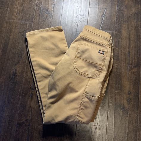 Tan Dickey Carpenter pants with some slight stains... - Depop