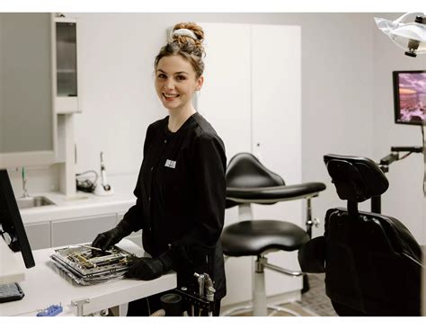 Dental hygienist preparing for root canal procedure at Vancouver ...