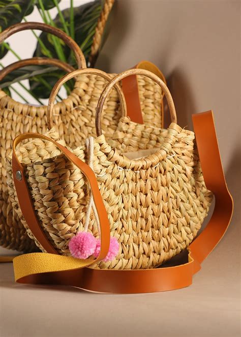 Get Pom-Pom Tassel Detail Small U-Shaped Bag at ₹ 1080 | LBB Shop