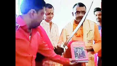 BJP MLA Sparks Controversy by Distributing Swords During Durga Puja ...