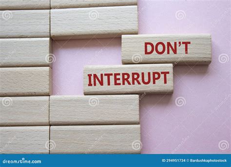 Dont Interrupt Symbol. Concept Word Dont Interrupt On Wooden Blocks ...