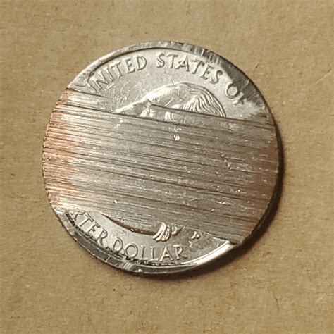 I know nothing about coins. Found this messed up quarter... was it made ...