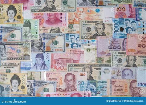 Closeup of Variety Banknote Around the World Include Dollar Yuan Baht Peso Won for Currency ...