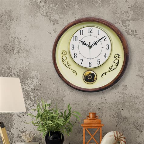 Round Plastic Clock with Golden Pendulum and wooden colored border - 1 ...