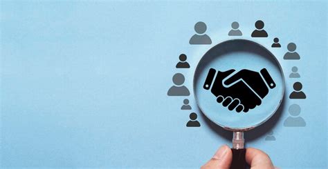 Top view design on blue background of hand shaking inside magnifier ...