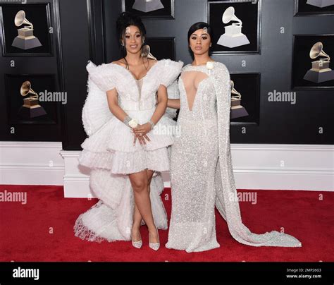 Cardi B, left, and sister Hennessy Carolina arrive at the 60th annual Grammy Awards at Madison ...