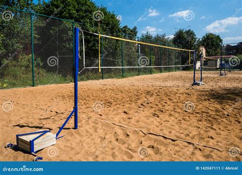 Volleyball Nets on Blue Poles with Concrete Weights for Balance Stock ...
