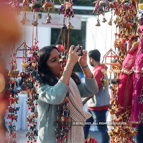 A girl takes a picture during at a three-day food festival organised by ...