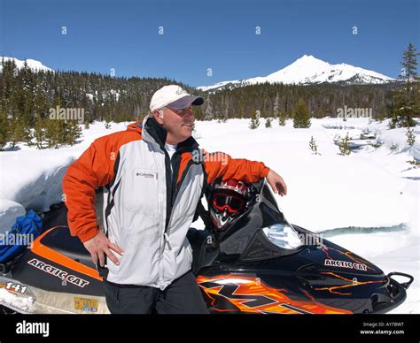 A Snowmobiler heads for Elk Lake Resort from Mount Bachelor Ski Area ...