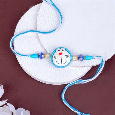 Send Teddy Rakhi N Doraemon Rakhi with Pencil Box Online | Rakhibazaar.com