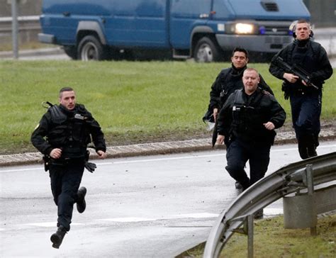 French police seal off town as they close in on newspaper killing ...