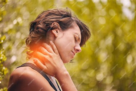 Premium Photo | Woman injury and neck pain from a workout with muscle strain and inflammation in ...