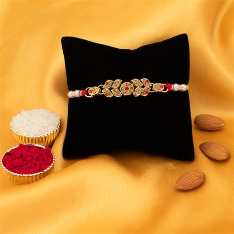 Sukkhi Divine Gold Plated Rakhi for Brother with Roli Chawal and Raksh ...