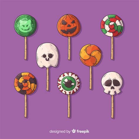 Hand drawn halloween candy collection on violet background | Free Vector
