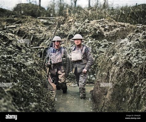 Two British soldiers in a flooded communication trench on the Western ...
