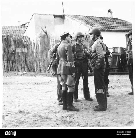 Colonel Caffee of the US 34th Infantry Division questions a captured ...