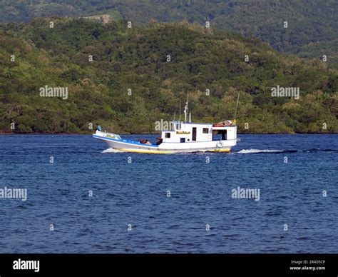 Maumere, Indonesia-May 23, 2023: An inter-island ferry in Indonesia is sailing from the port of ...