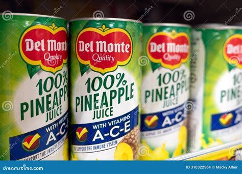 Del Monte Philippine Pineapple Juice in Can on a Grocery Shelf ...