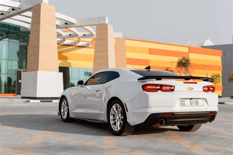 Rent Chevrolet Camaro White & Orange in Dubai - Coupe - Octane.Rent