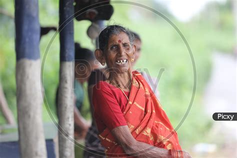 Image of Indian Old Woman smiling with crooked teeth-UA883197-Picxy