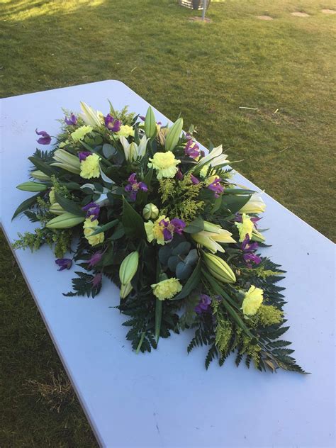 Casket double ended funeral spray, white, purple and yellow. Lilies ...