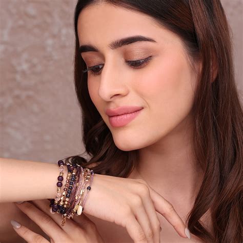 Set of Layered Bracelets with Purple, Pink, and Golden Beads – toniq ...
