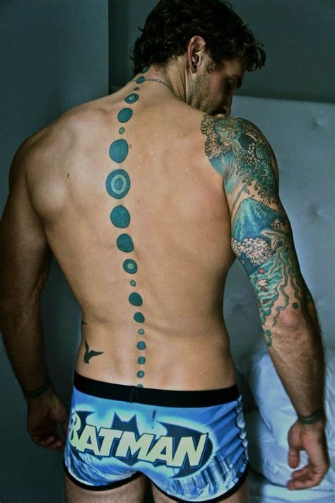 777 spine tattoo ideas male