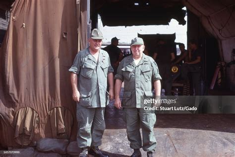 Full-length frontal shot of two US Army servicemen, wearing fatigues ...