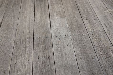 closeup photo of some old rough wooden floor boards background texture ...