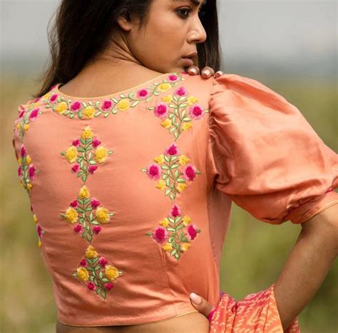 Peach boat neck blouse with floral embroidered detailing – Dailybuyys