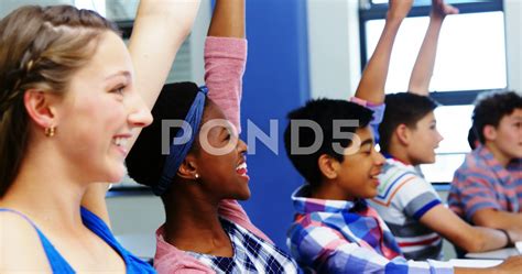 Student Raising Hand In Class