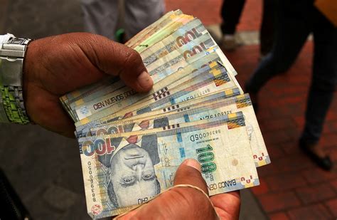 Rising sol: Peru's currency gains lift from rate hikes, trade winds | Reuters