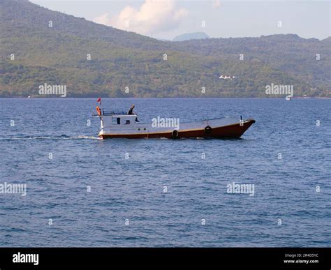 Maumere, Indonesia-May 23, 2023: An inter-island ferry in Indonesia is sailing from the port of ...