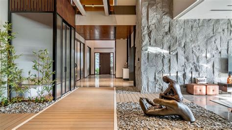 A bungalow in Ludhiana uses a slick material palette to play up its ...