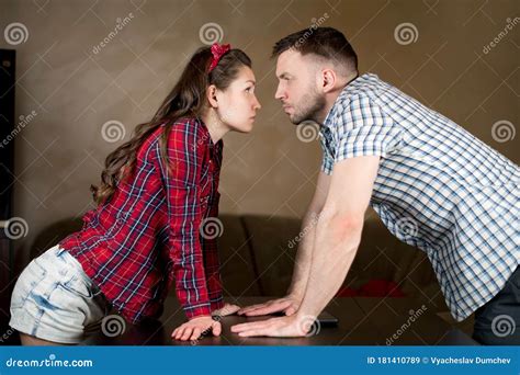 Husband and Wife Look at Each Other in Silent Anger, Bending Over the ...