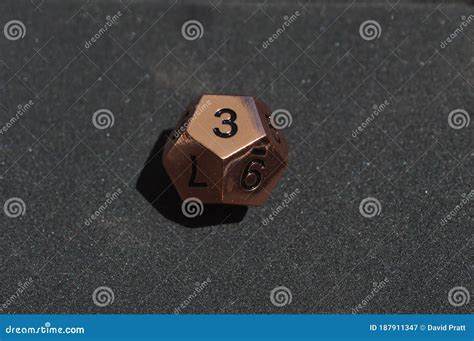 Copper Metallic D12 Twelve Sided Dice on Foam Surface Stock Image ...