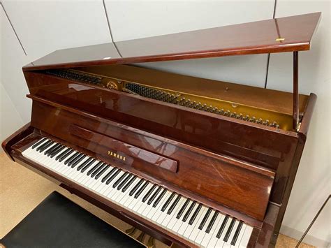 Lot 745 - Yamaha upright grand piano.