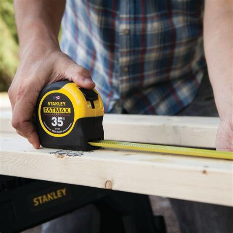 tape measure measuring wood stud layout for framing house construction accurate measurement. Must-Have Tools for Framing a House (Complete 2026 Guide)
