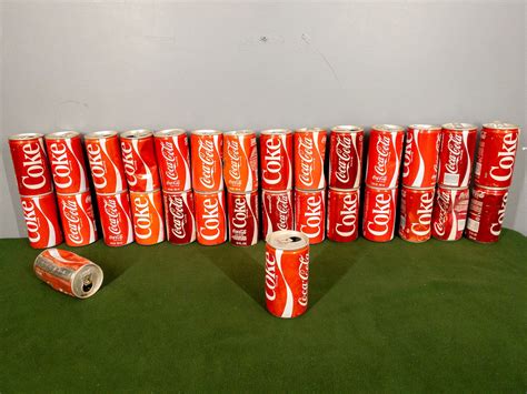 Coca-Cola Collectible Vintage Soda Cans Lot #10799 | Auctionninja.com
