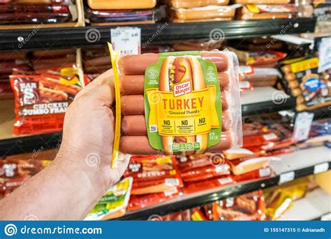 Shoppers Hand Holding a Plastic Package of Oscar Mayer Brand Uncured ...