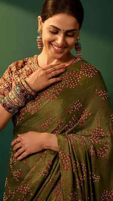 Genelia exudes ethnic elegance in a regal olive-green saree