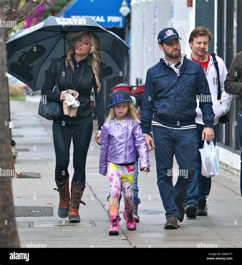 Jason Priestley takes a walk in the rain with his family through Studio ...