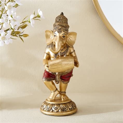 Dynamic Lord Ganesha with Dholak Statue | Polyresin Golden Musical Gan ...