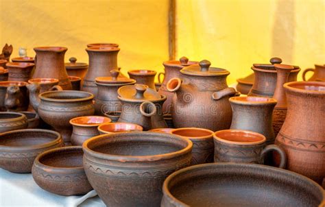 Traditional Russian Pottery. Clay Cups, Jugs, Plates, and Bowls on a ...