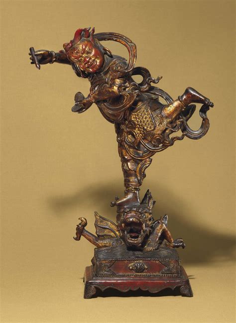 A GILT-LACQUERED BRONZE FIGURE OF KUI XING