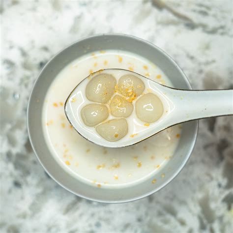 Glutinous sweet rice ball w coconut ginger sauce banh ja neuk – Artofit