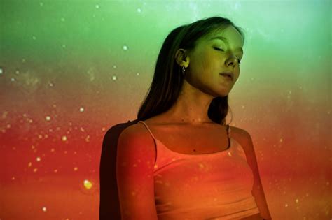 Young woman standing in universe texture projection | Free Photo