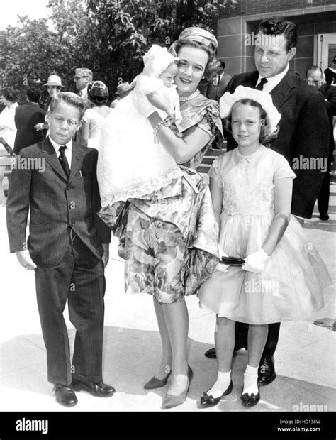 Kay Gable, widow of Clark Gable, with their son, John Clark Gable, christening at St. Cyril's ...