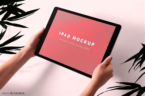 Man Holding Ipad Mockup Psd