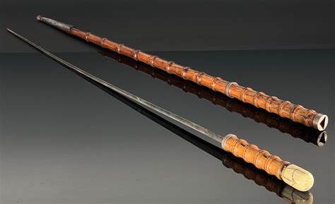 At Auction: Ivory Tip Faux Bamboo Walking Stick Sword Hidden cane
